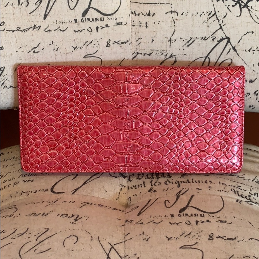 Pink faux alligator clutch